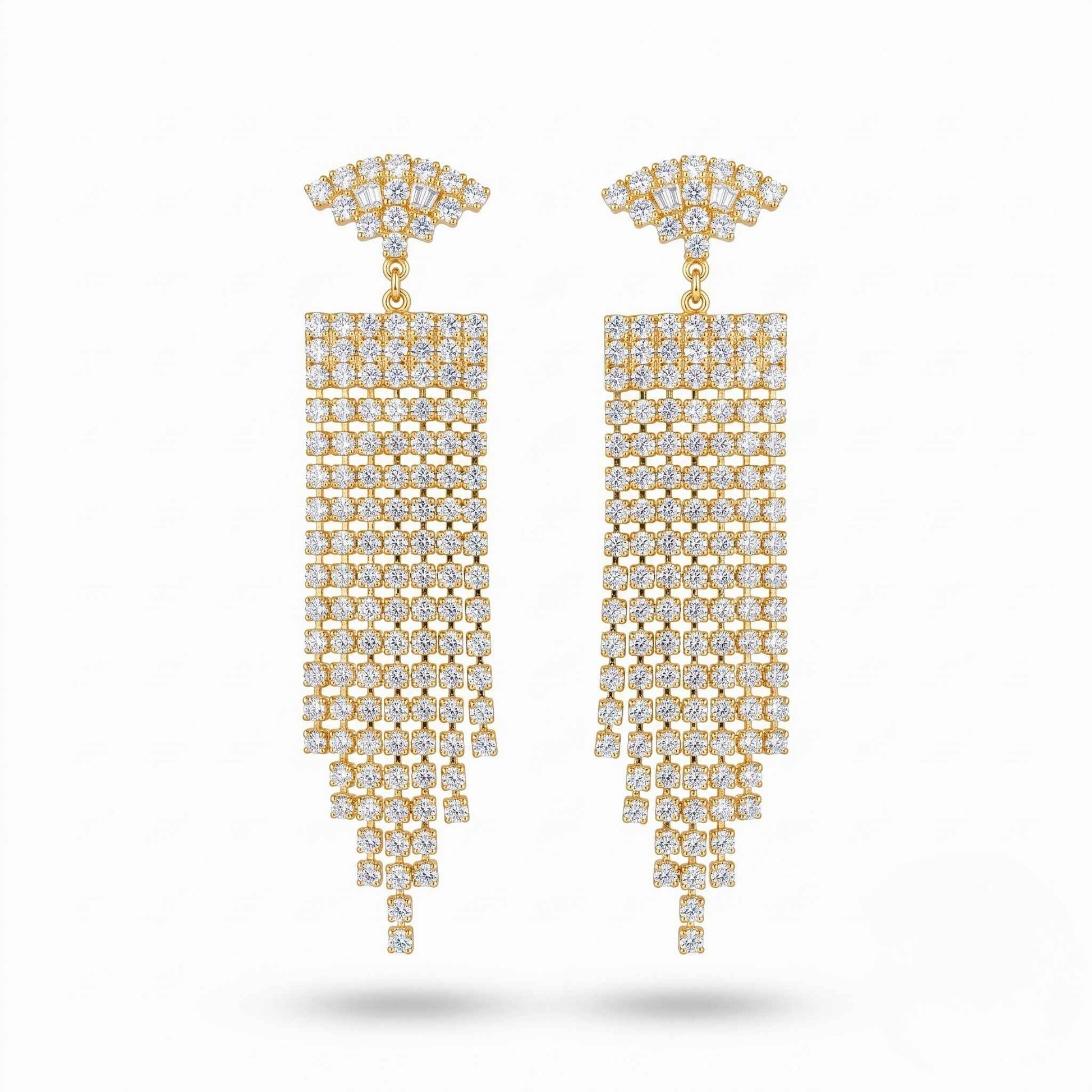 Pair of elegant gold plated dangle earrings featuring shimmering cubic zirconia gemstones in a multi-strand chandelier design set against a plain background.