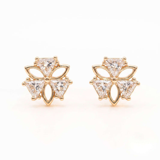 A detailed close-up picture of a pair of gold plated stud earrings in a sweet clover design featuring cubic zirconia from the jewellery 4 Elegance on a white background.