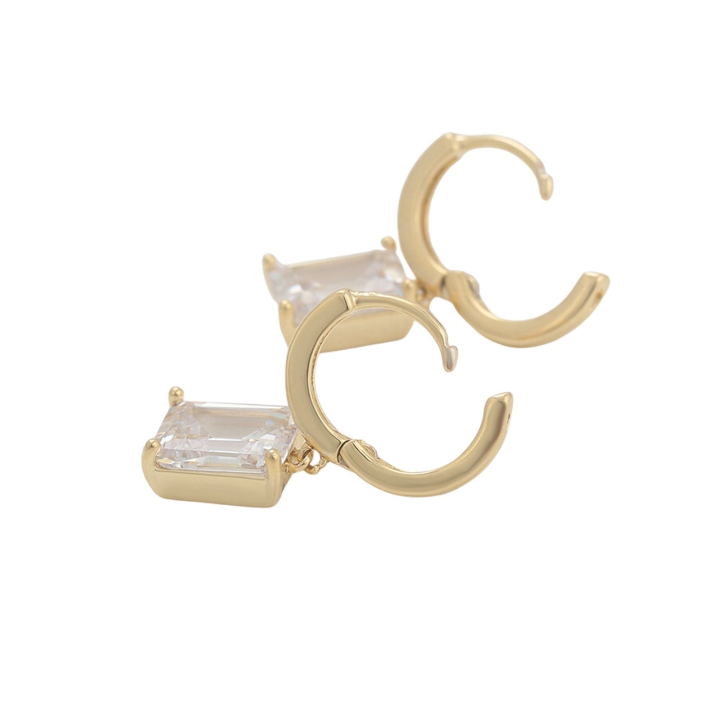 A pair of Jewellery 4 Elegance gold drop earrings featuring smooth huggie hoops suspending a brilliant emerald cut cubic zirconia gemstone on a white background