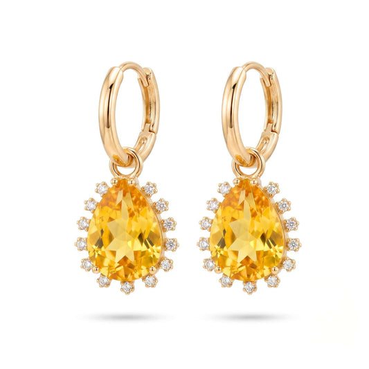 Gold plated hinged hoop drop earrings featuring pear-cut yellow stones surrounded by a delicate cubic zirconia halo on a polished gold finish.