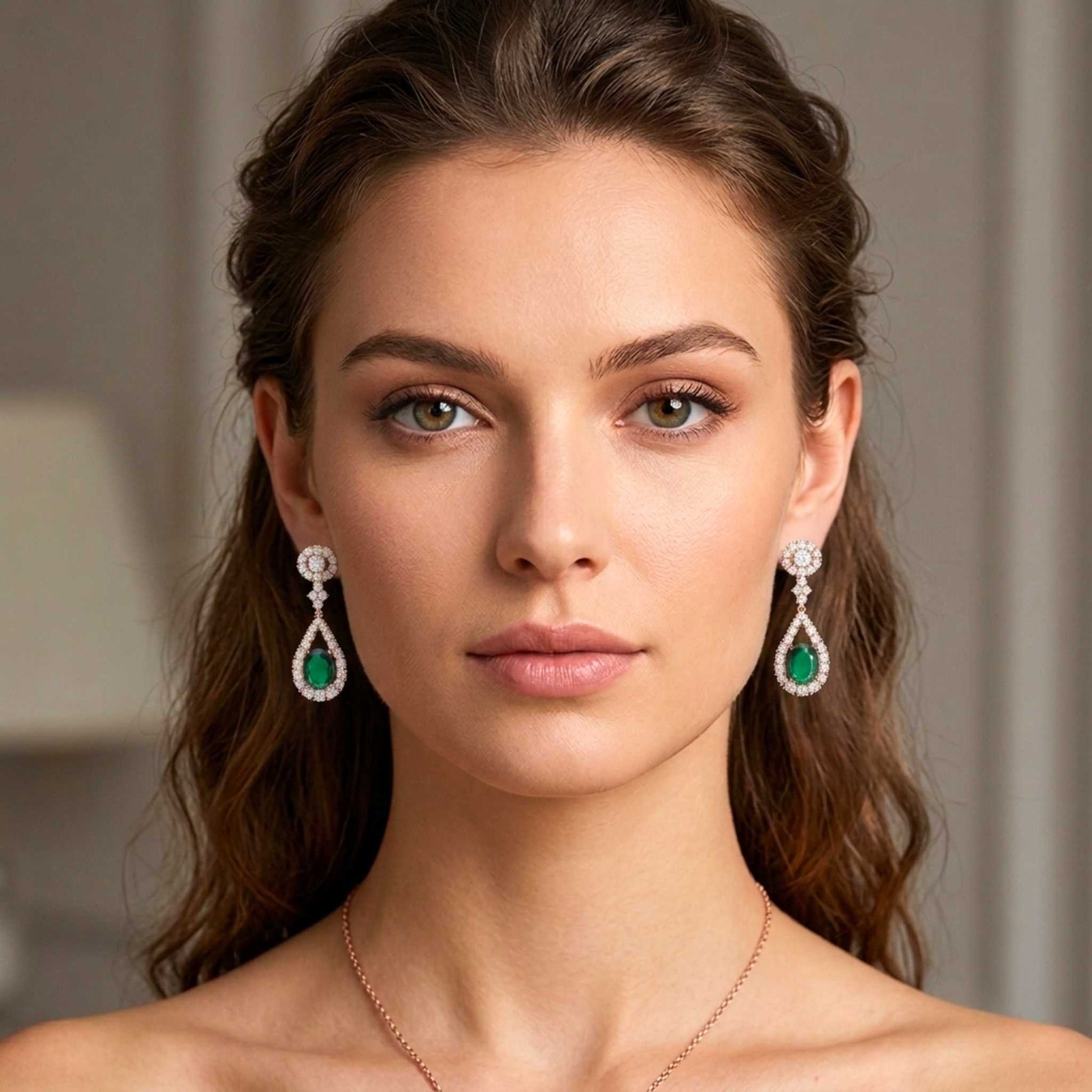 Elegant model wearing Rose Gold Emerald tear drop earrings with sparkling accents.  Digitally rendered model for scale