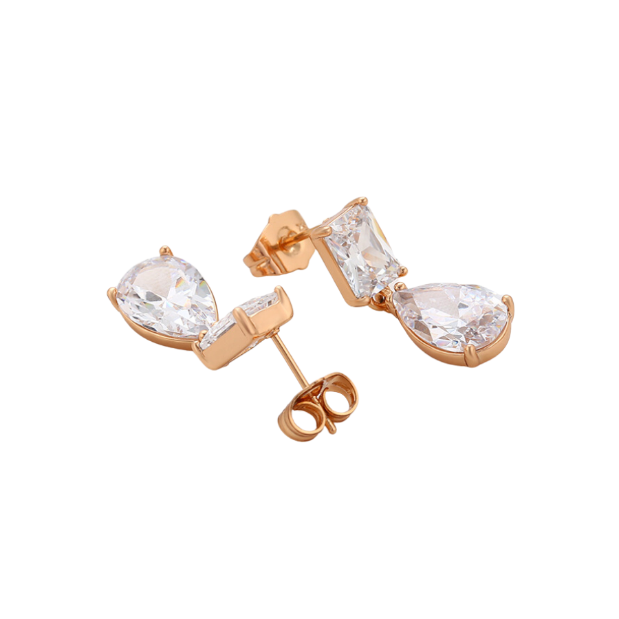 Gold earrings with clear zirconia on a white background